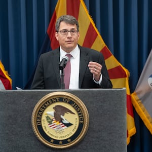 U.S. Attorney for the District of Arizona Gary Restaino speaks alongside FBI Phoenix FIeld Office Special Agent in Charge Akil Davis