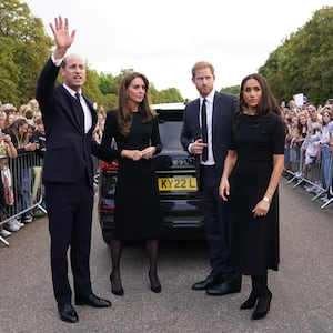 Catherine, Princess of Wales, Prince William, Prince of Wales, Prince Harry, Duke of Sussex, and Meghan, Duchess of Sussex meet members of the public on the long Walk at Windsor Castle on September 10, 2022 in Windsor, England.