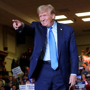 Donald Trump gestures during a campaign rally in Claremont, New Hampshire