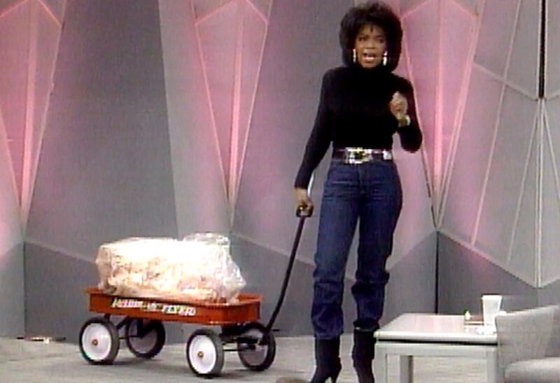 Oprah brings a red wagon filled with fat on stage