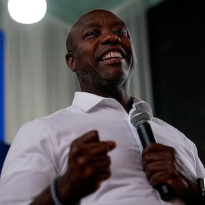 Tim Scott holding a microphone