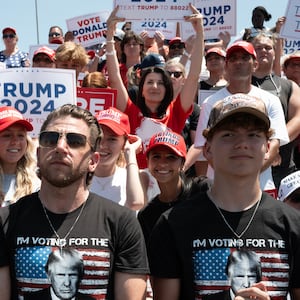 People attend a campaign rally hosted by Republican presidential candidate former President Donald Trump at Festival Park on June 18, 2024 in Racine, Wisconsin