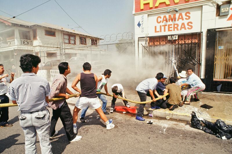 galleries/2012/04/26/dramatic-l-a-riots-photos/los-angeles-riots-hose_wywc1a