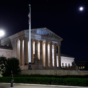 Demand Justice projects \"Stop The Steal\" upside down American flag on the U.S. Supreme Court to call attention to Justice Alito's alleged actions on May 21, 2024 in Washington, DC. 