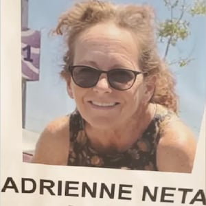 Photo of Adrienne Neta smiling used at a press conference.