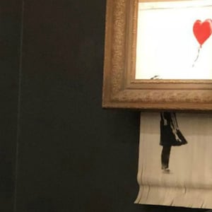 181006-banksy-painting-self-destructs-cheat_aufdgn