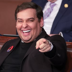 Former U.S. Rep. George Santos (R-NY) (L) sits with Rep. Matt Gaetz (R-FL) at U.S. President Joe Biden's State of the Union address.