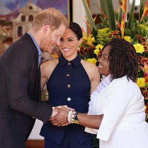 Prince Harry and Colombia's Vice President Francia Marquez shake hands, as Meghan, Duchess of Sussex, looks on, in Bogota, Colombia August 15, 2024.