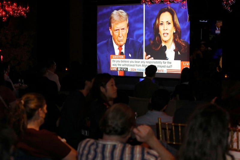 A TV shot of Harris and Trump debating.