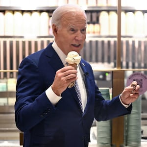 U.S. President Joe Biden speaks with host Seth Meyers as they enjoy an ice cream at Van Leeuwen Ice Cream after taping an episode of “Late Night with Seth Meyers” in New York City.