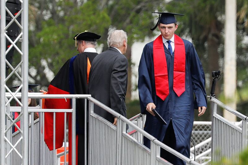 Barron crosses the stage during his commencement ceremony.