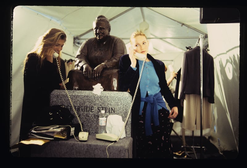 Carolyn Bessette-Kennedy (left) is pictured backstage at the Spring-Summer 1994 Calvin Klein runway show during New York Fashion Week on November 2, 1993.