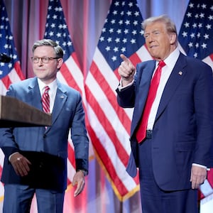 Speaker of the House Mike Johnson welcomes U.S. President-elect Donald Trump onstage at a House Republicans Conference meeting at the Hyatt Regency on Capitol Hill on November 13, 2024 in Washington, DC.