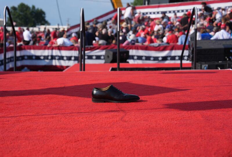 A shoe is left on stage after a former president Donald Trump is assisted offstage