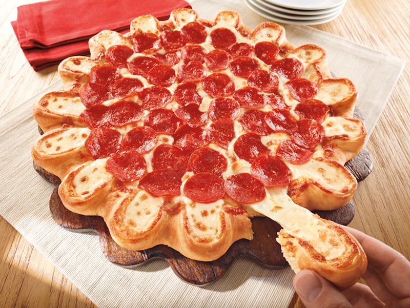 articles/2013/04/04/pizza-hut-s-evil-genius/130402-unhealthy-pizza-hut-cheesy-crust_ijrbzw