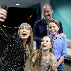 Taylor Swift takes a selfie with Prince William and his children Princess Charlotte and Prince George. 