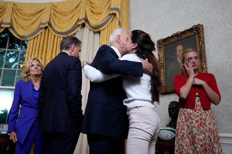 U.S. President Joe Biden hugs family members after addressing the nation from the Oval Office of the White House on July 24, 2024 in Washington, DC.