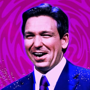 A photo illustration of Ron DeSantis in front of a psychedelic background.