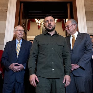 Ukrainian President Volodymyr Zelensky (C) speaks to reporters briefly following a meeting with Senate Minority Leader Mitch McConnell (R-KY) (2nd L), Senate Majority Leader Charles Schumer (D-NY) (2nd R)