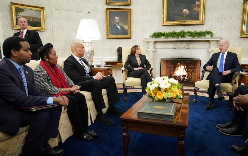 People in the Oval Office including Joe Biden, Kamala Harris and from left Joe Neguse, Sheila Jackson Lee and Corey Booker