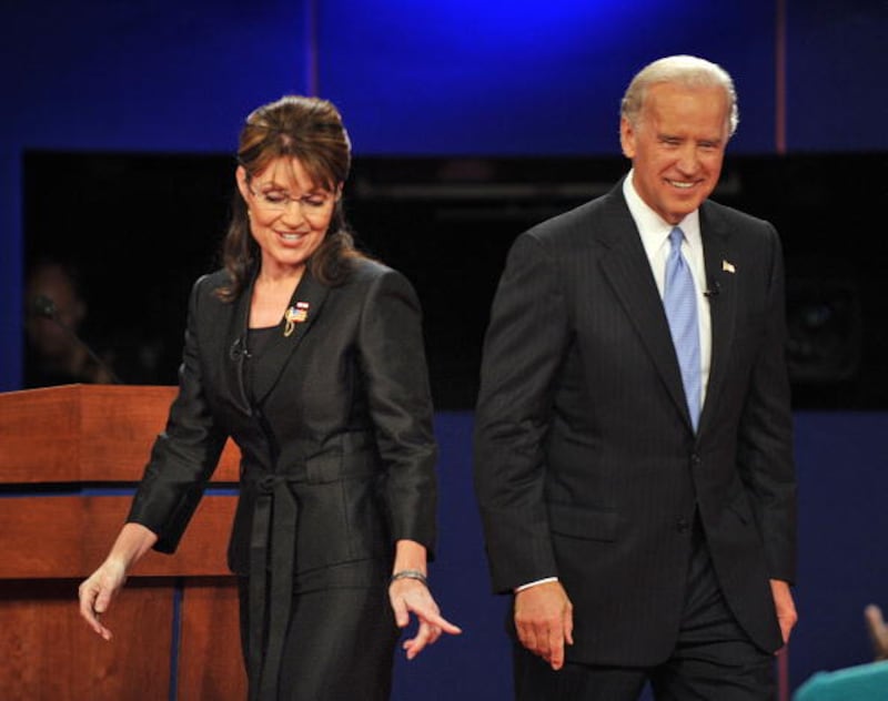 Sarah Palin, left, and Joe Biden (R) walk on stage following their vice presidential debate on October 2, 2008 at Washington University in St. Louis, Missouri.