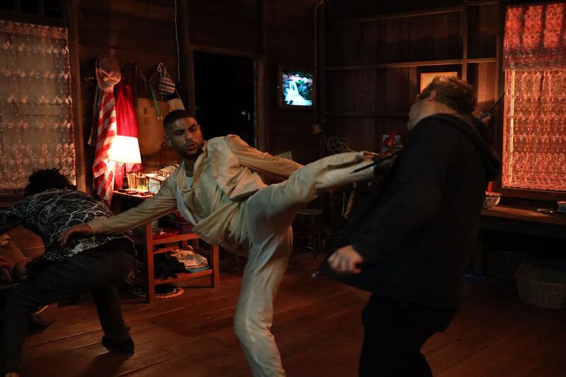 A still of Nassim Lyes kicking a man in the face in 'Mayhem!”