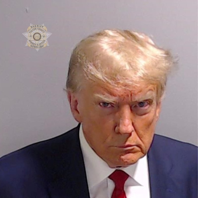 FILE PHOTO: Former U.S. President Donald Trump is shown in a police booking mugshot released by the Fulton County Sheriff's Office, after a Grand Jury brought back indictments against him and 18 of his allies in their attempt to overturn the state's 2020 election results in Atlanta, Georgia, U.S., August 24, 2023. Fulton County Sheriff's Office/Handout via REUTERS/File Photo  THIS IMAGE HAS BEEN SUPPLIED BY A THIRD PARTY.