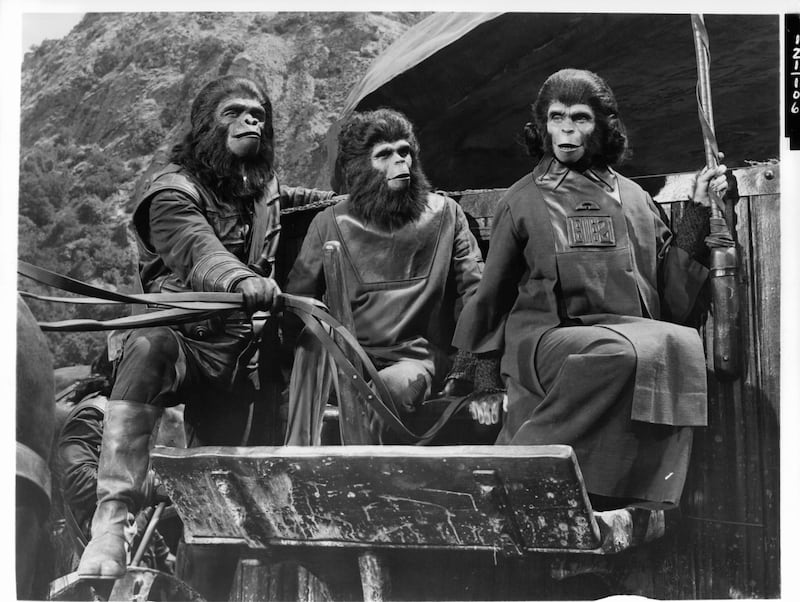 A still from Planet of the Apes showing apes on a cart