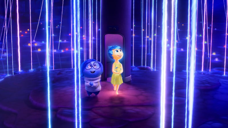 A photo including Sadness and Joy in the film Inside Out 2 on Disney