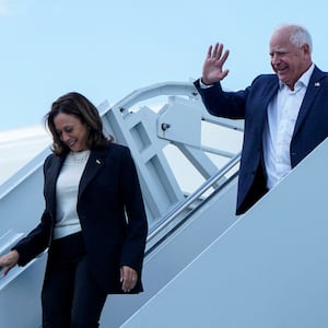 Vice President Kamala Harris and Minnesota Gov. Tim Walz walk down the steps from Air Force Two at Hilton Head International Airport in Savannah, Georgia.