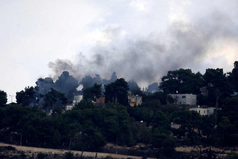 Photo taken in Mays Al Jabal, south Lebanon, on Oct. 19, 2023 shows smoke rising from an Israeli military point in Al Manara after a rocket fired by Hezbollah fighter hit it. 