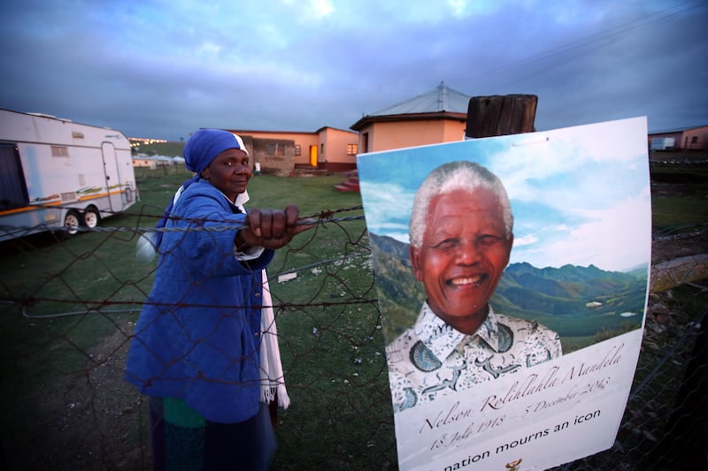 articles/2013/12/15/nelson-mandela-laid-to-rest-in-moving-funeral-ceremony/131215-mandela-gevisser-tease_qinsdu