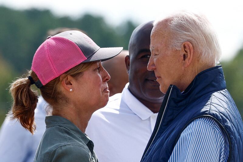 Asheville Mayor Esther Manheimer fights back tears while looking at Joe Biden.