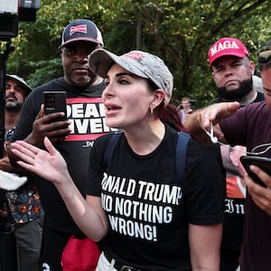 Laura Loomer speals demonstrators on August 24, 2023, near the entrance of the Fulton County Jail as former President Donald Trump prepared to turn himself in to be processed after being indicted in Atlanta, Georgia.