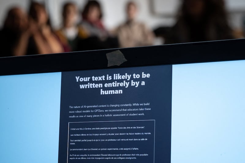 Teachers are seen behind a laptop during a workshop on ChatGpt bot organised for by the School Media Service (SEM) of the Public education of the Swiss canton of Geneva, on February 1, 2023. 