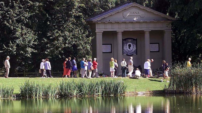 Visitors pay their respects at the memorial to Diana, Princess of Wales, at Althorp House in Northamptonshire.