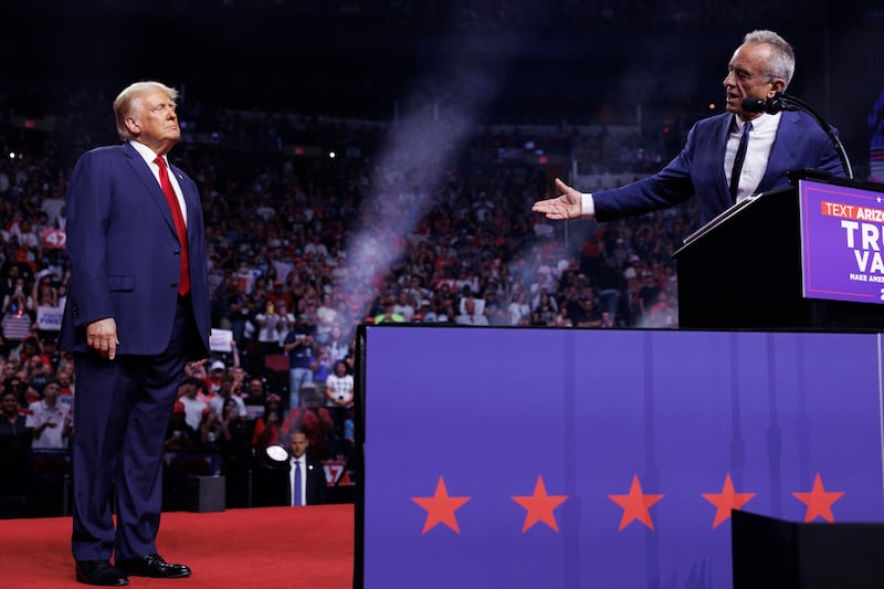 Robert F. Kennedy Jr. speaks on stage beside Republican presidential nominee Donald Trump during a campaign event in Glendale, AZ.