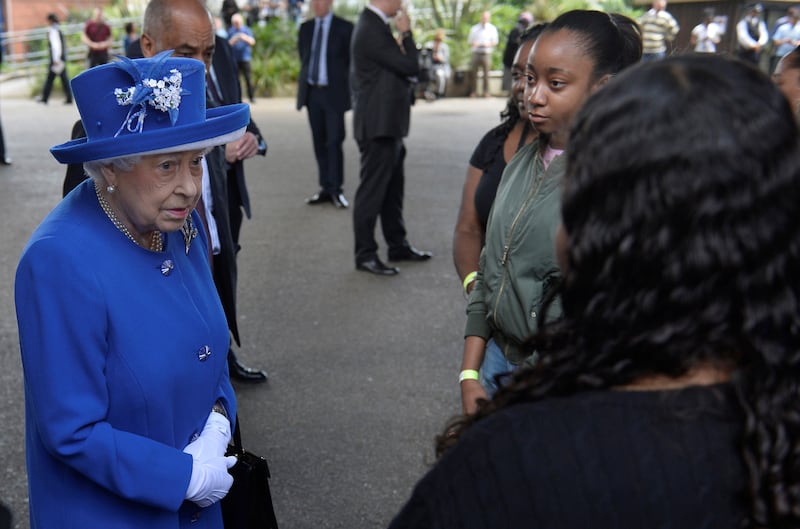 Queen Elizabeth meets residents of the Grenfell Tower block near the scene of the fire that destroyed the block, in north Kensington, West London, Britain June 16, 2017.