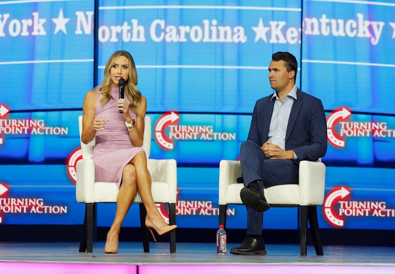 Republican National Committee co-chair Lara Trump and right-wing political activist Charlie Kirk speak during a Turning Point USA event.