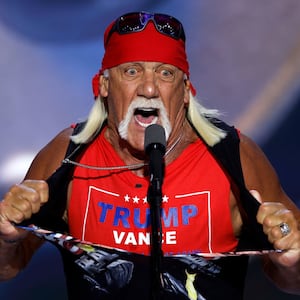 Professional wrestler Hulk Hogan rips his shirt as he speaks on stage on the fourth day of the Republican National Convention in Milwaukee.