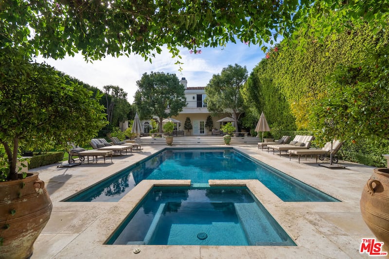 A view of the property at 722 North Elm Drive in Beverly Hills, once owned by the Menendez family, with its expansive pool in the foreground.