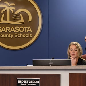 Board member Bridget Ziegler, seated at a Sarasota County School Board meeting in Sarasota, Fla.