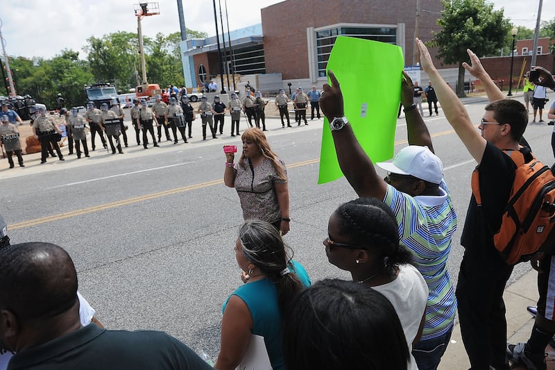 articles/2014/08/11/what-you-gonna-do-kill-us-all-protesters-ask-ferguson-police/140811-mike-brown-embed2_gsommy