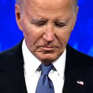 US President Joe Biden looks down as he participates in the first presidential debate of the 2024 elections