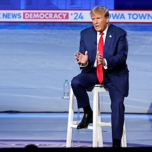 Donald Trump speaks as Fox News moderators Bret Baier and Martha MacCallum look on during a town hall in Des Moines, Iowa.