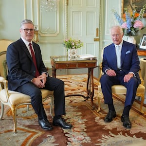 Britain's King Charles talks with Sir Keir Starmer during an audience at Buckingham Palace