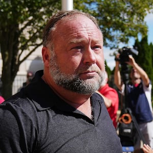 InfoWars founder Alex Jones walks outside Waterbury Superior Court during his trial in 2022. 