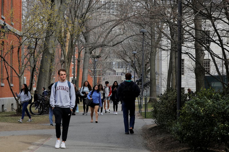 Students walk through the Yard at Harvard University.