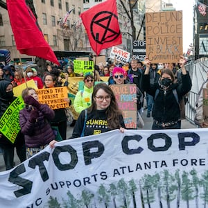 Protesters march against the construction of Cop City, a police training facility outside Atlanta, Georgia. 