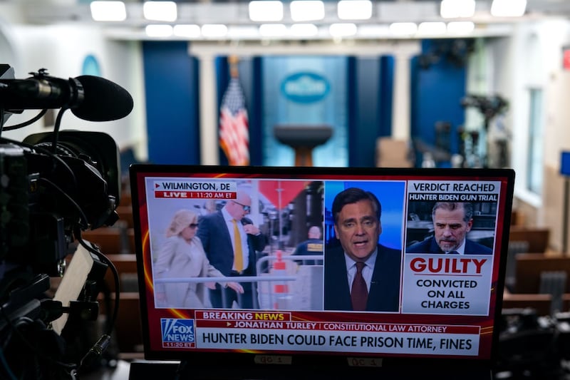 A television monitor displays a newscast with the verdict in the Hunter Biden gun trial in the Brady Press Briefing Room of the White House.